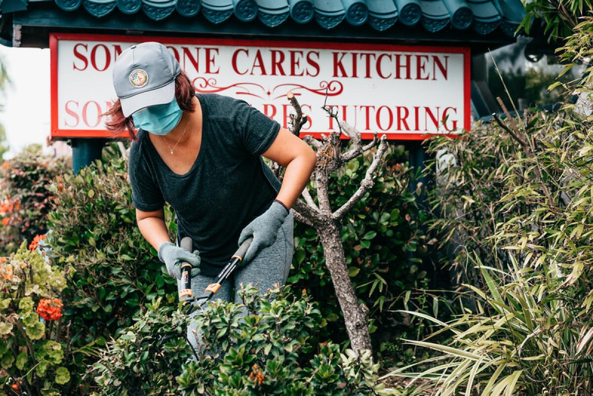 A volunteer gardens at the Someone Cares Soup Kitchen as part of Love Costa Mesa 2021, a community- wide day of service.