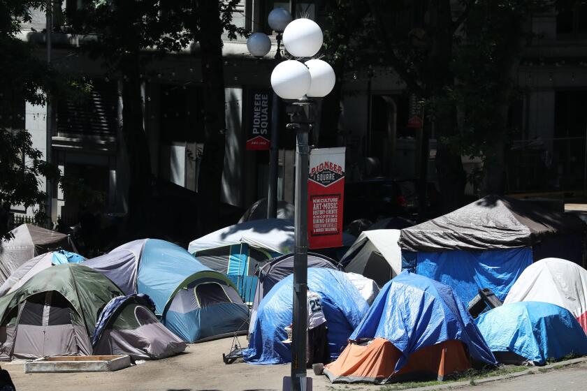King County Council member Reagan Dunn has proposed legislation seeking to have the homeless encampment at City Hall Park, seen Tuesday, June 22, 2021, south of the King County Courthouse in Seattle, condemned as a public safety hazard. (Ken Lambert/The Seattle Times via AP)