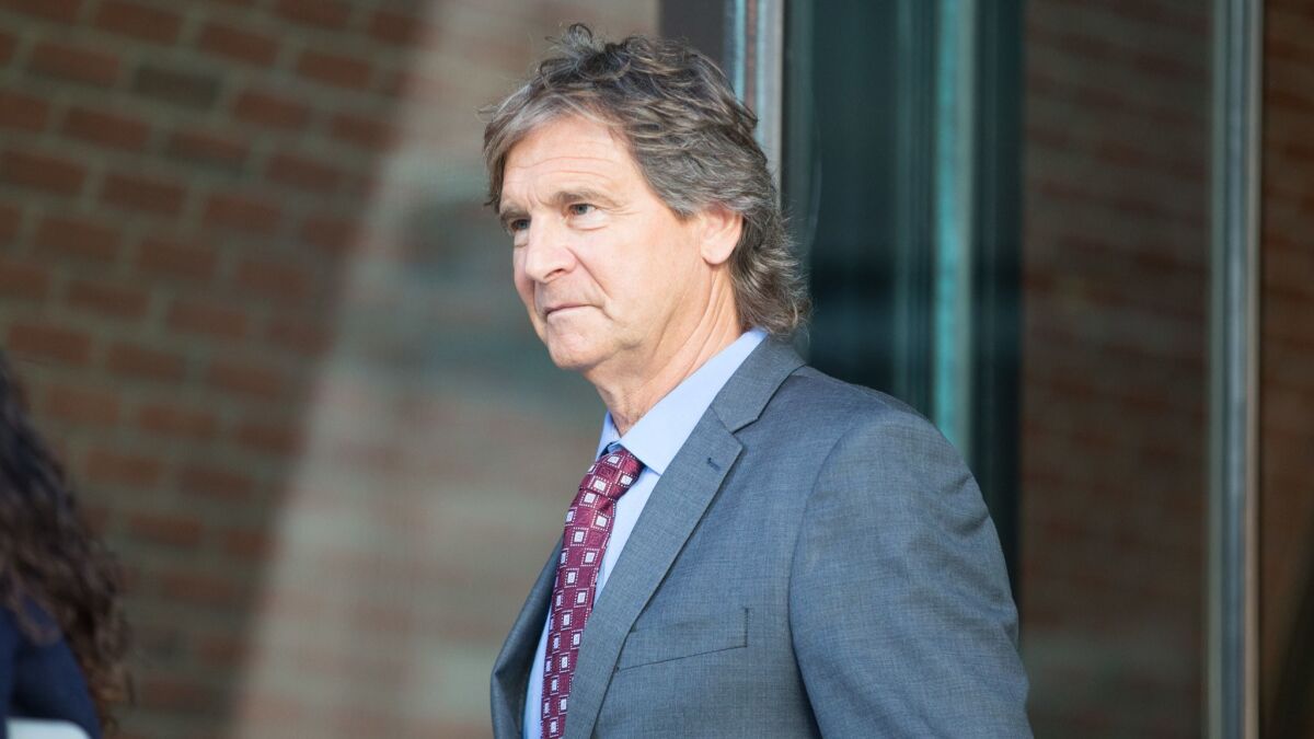 Jovan Vavic, former water polo coach at USC, leaves following his arraignment at federal court in Boston on March 25.