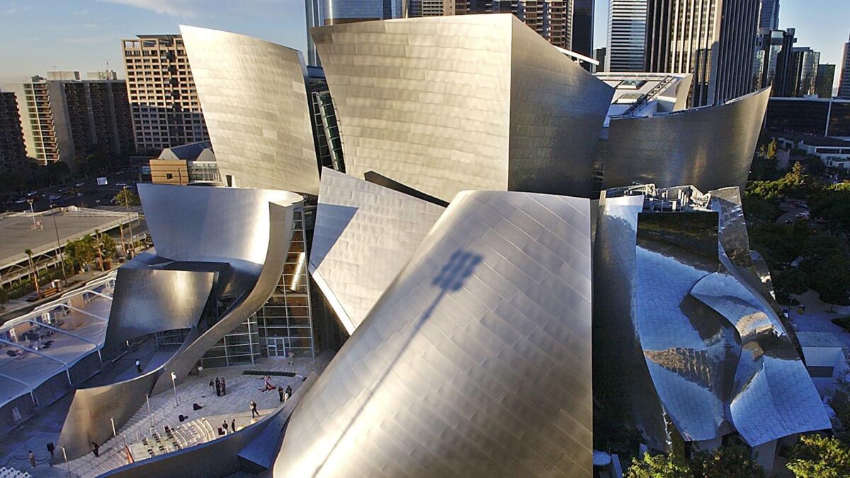 The Walt Disney Concert Hall with the L.A. skyline in the background