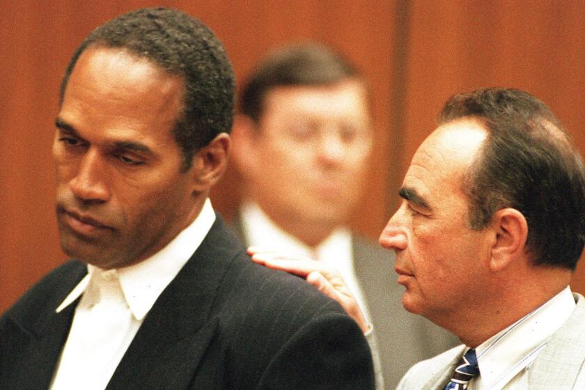 Defense attorney Robert Shapiro with client O.J. Simpson at the former football star's' first arraignment on June 20, 1994.