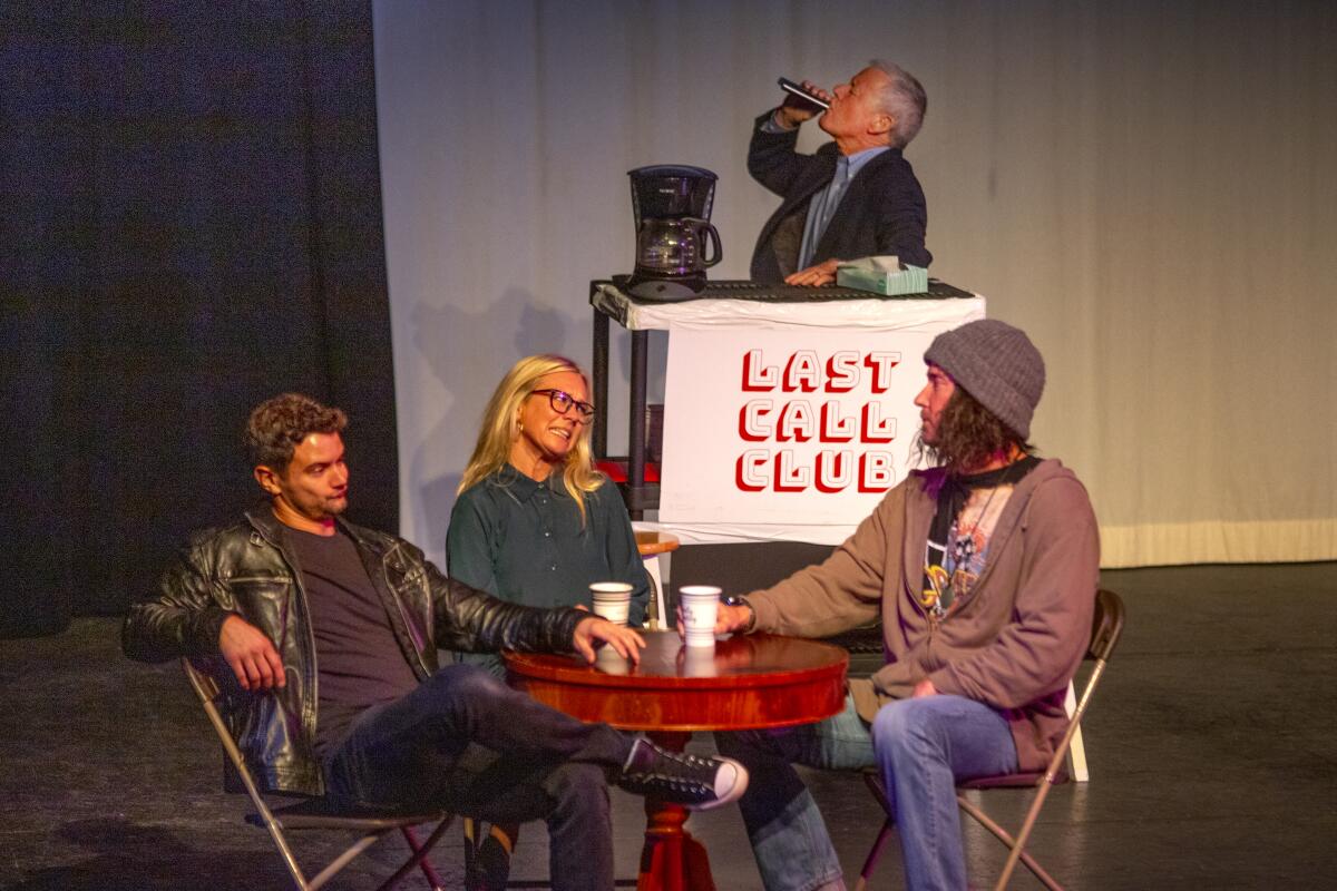 Johnny Ray, played by Patrick Taylor, left, talks with other recovery group members while Windsor (Greg Morrell) sneaks a drink in "The Last Call," a one-act play by Newport Beach resident Dave Ronquillo about alcoholism and recovery that was staged Saturday at the Huntington Beach Library Theater.