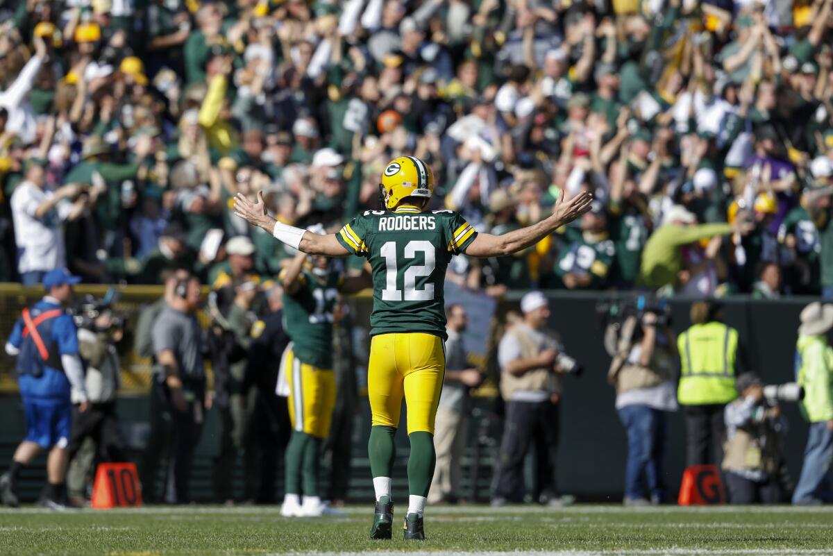Green Bay Packers quarterback Aaron Rodgers reacts after throwing a touchdown pass to Jake Kumerow during a game against the Oakland Raiders on Sunday.