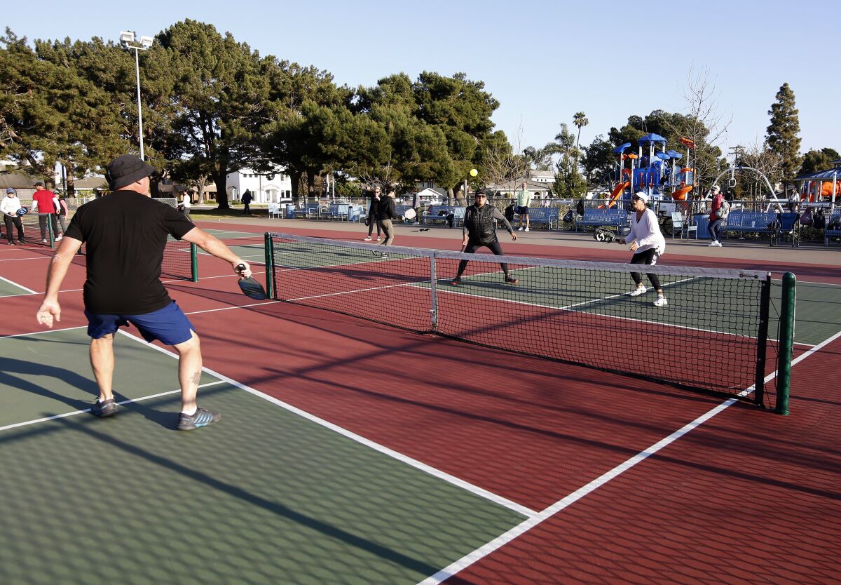Players enjoy a game of late-afternoon pickleball in Huntington Beach in 2021. 