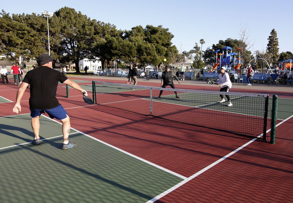 Players enjoy a game of late-afternoon pickleball in Huntington Beach in 2021.