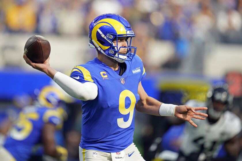 Los Angeles Rams quarterback Matthew Stafford (9) throws during the first half of an NFL football game.