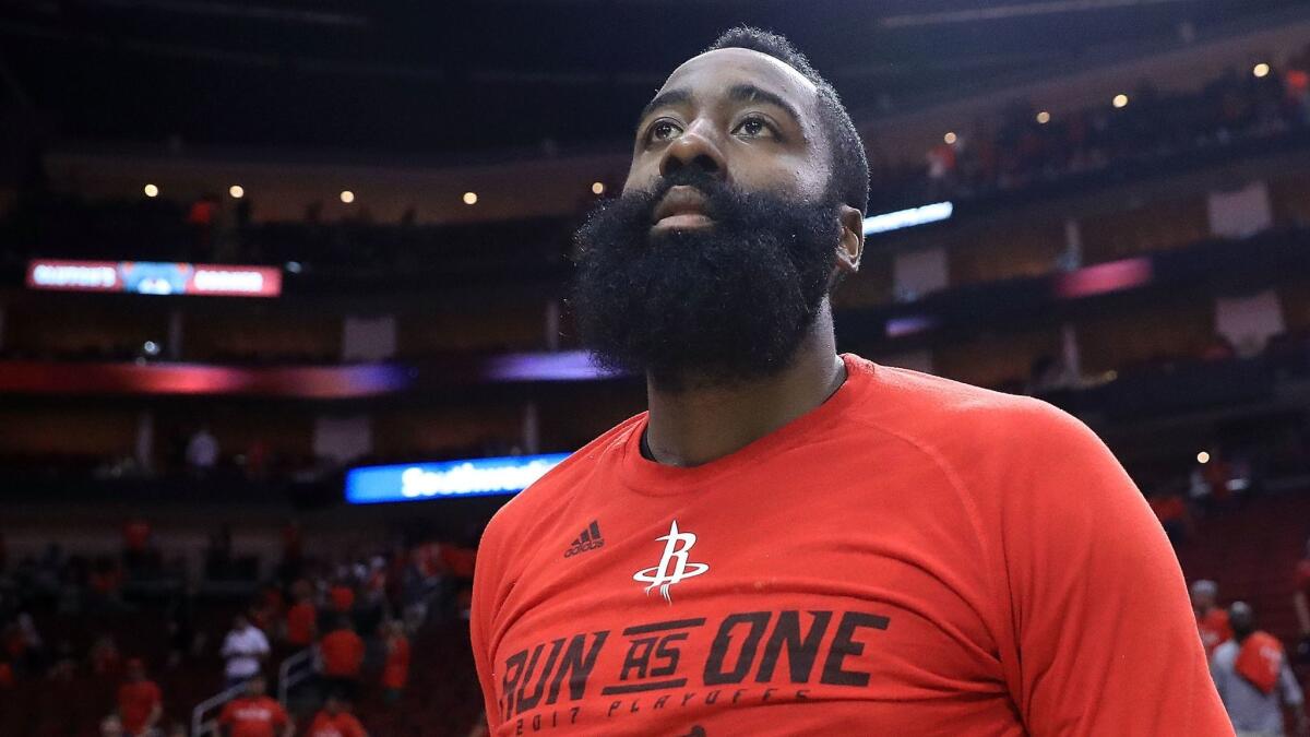 James Harden leaves the court after Houston's 114-75 loss to San Antonio in Game 6 of the teams' Western Conference semifinal series on May 11.