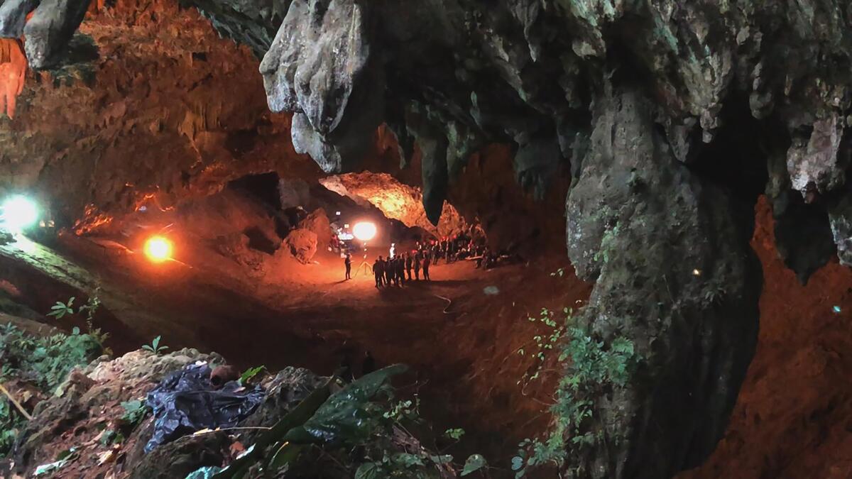 In this image provided by National Geographic is a scene from "The Rescue" documentary, which chronicles the 2018 rescue of 12 Thai boys and their soccer coach, trapped deep inside a flooded cave. The documentary by directors E. Chai Vasarhelyi and Jimmy Chin opens in theaters in Oct. 2021. (National Geographic via AP)
