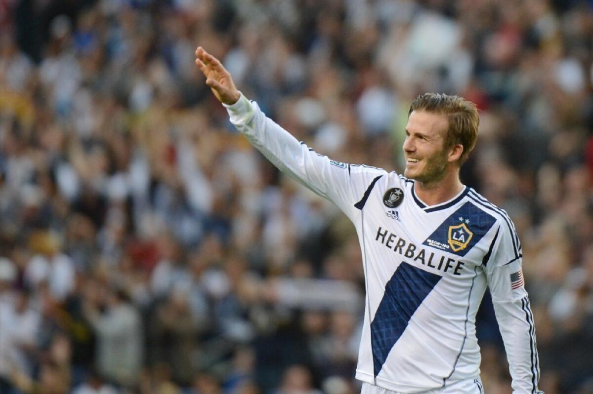 David Beckham walks off the field after playing his final game with the Galaxy in December.