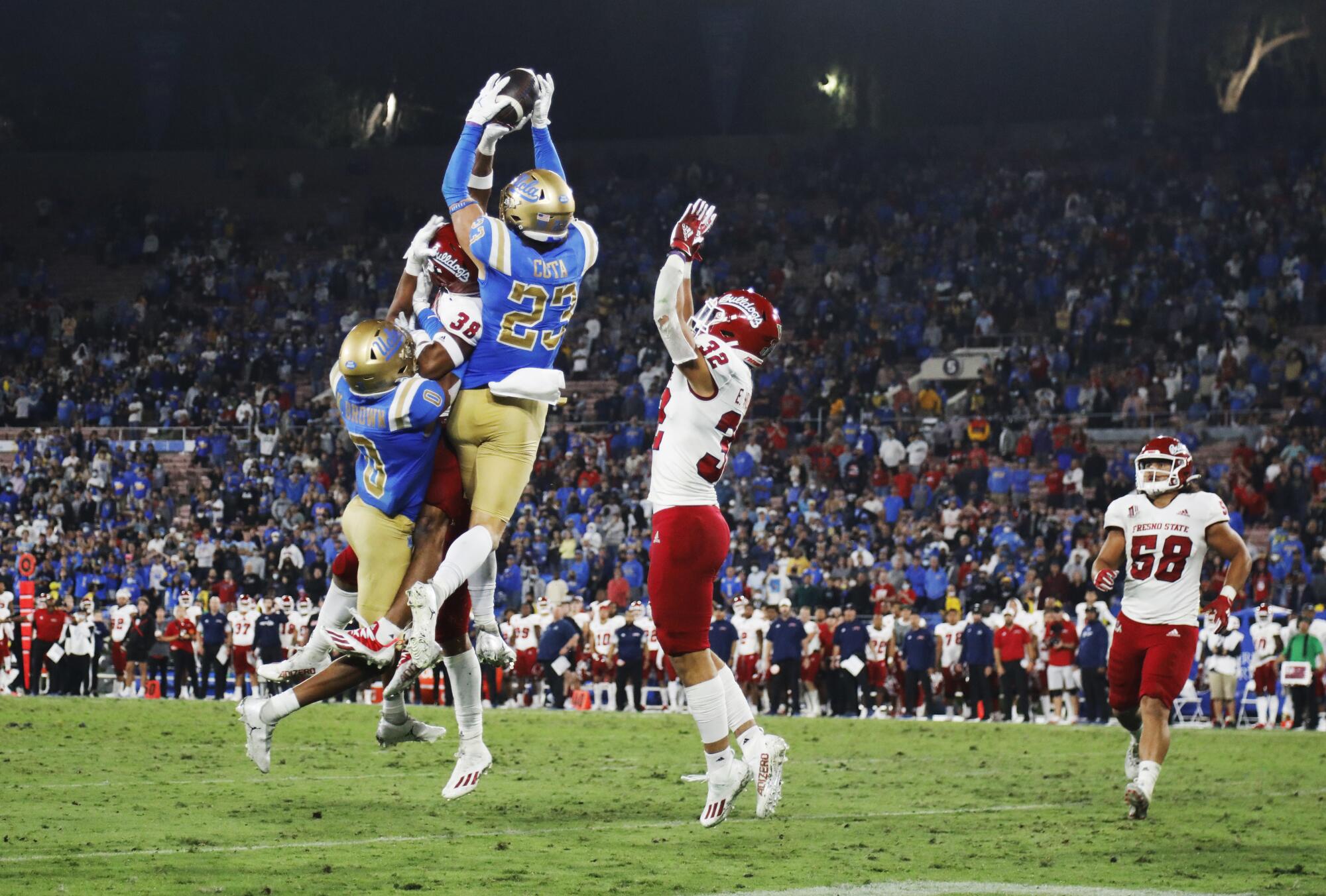 Fresno State's Bralyn Lux (38) deflect a Hail Mary pass.