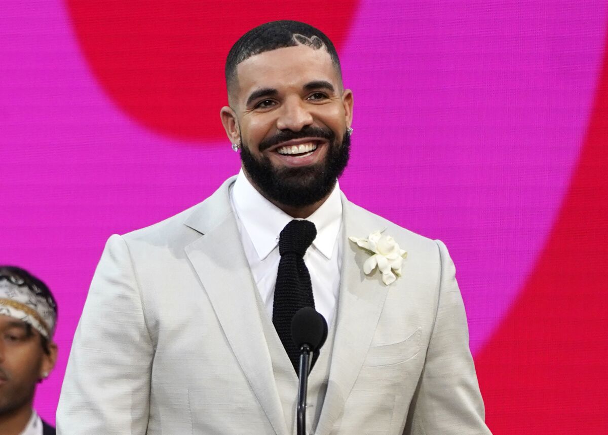 FILE - Drake accepts the artist of the decade award at the Billboard Music Awards on Sunday, May 23, 2021, at the Microsoft Theater in Los Angeles. Drake wants no part in competing for a Grammy. The four-time Grammy winner and his management asked the Recording Academy to withdraw his two nominations from the final-round ballot, a person familiar with the situation told The Associated Press, Monday, Dec. 6, 2021. The person said that Drake’s request was honored by the academy. (AP Photo/Chris Pizzello, File)