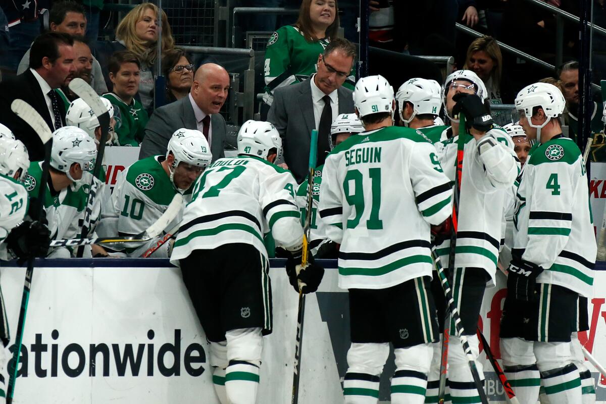 Dallas Stars coach Jim Montgomery talks to his players during a timeout in a game against the Columbus Blue Jackets on Oct. 16.