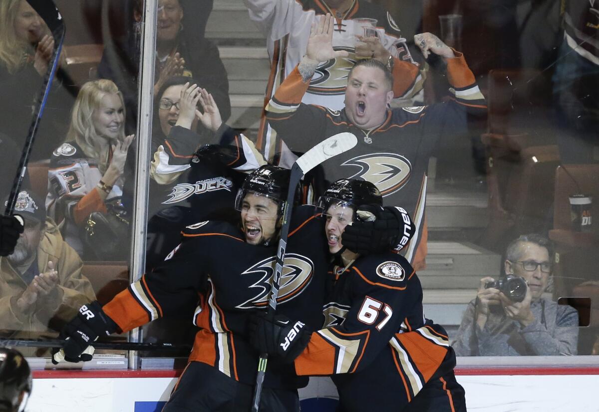 Ducks forward Emerson Etem, left, celebrates a goal with teammate Rickard Rakell against the Detroit Red Wings on Feb. 23.