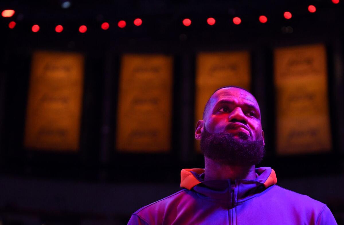 Lakers star LeBron James curls his lip during pregame introductions.
