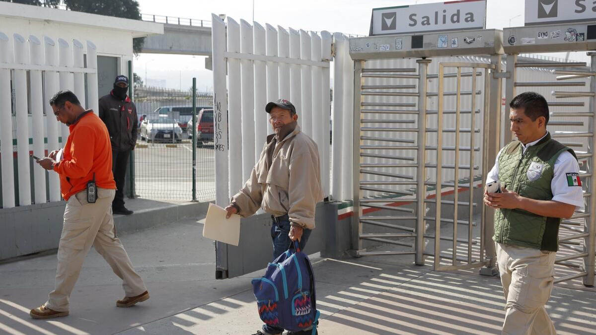 Carlos Catarldo Gomez of Honduras, center, enters Mexico after applying for asylum in the U.S. under a policy pushed by the Trump administration even though the government argues that Mexico is dangerous.