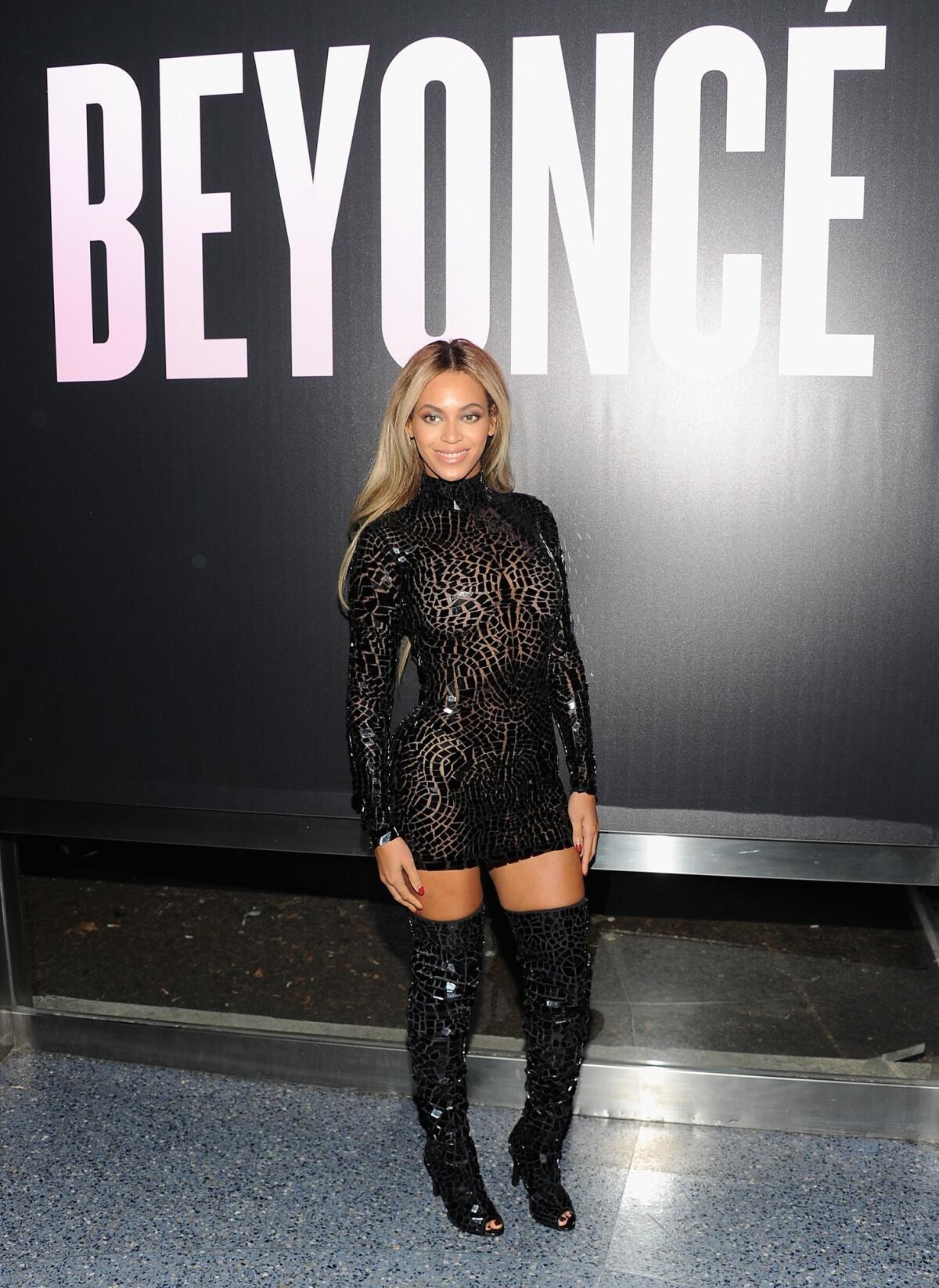 Beyonce stopped by a Wal-Mart store for a little shopping of her own, including a copy of her fifth self-titled album. Then she played Santa, paying for shoppers' purchases to the tune of $37,500.