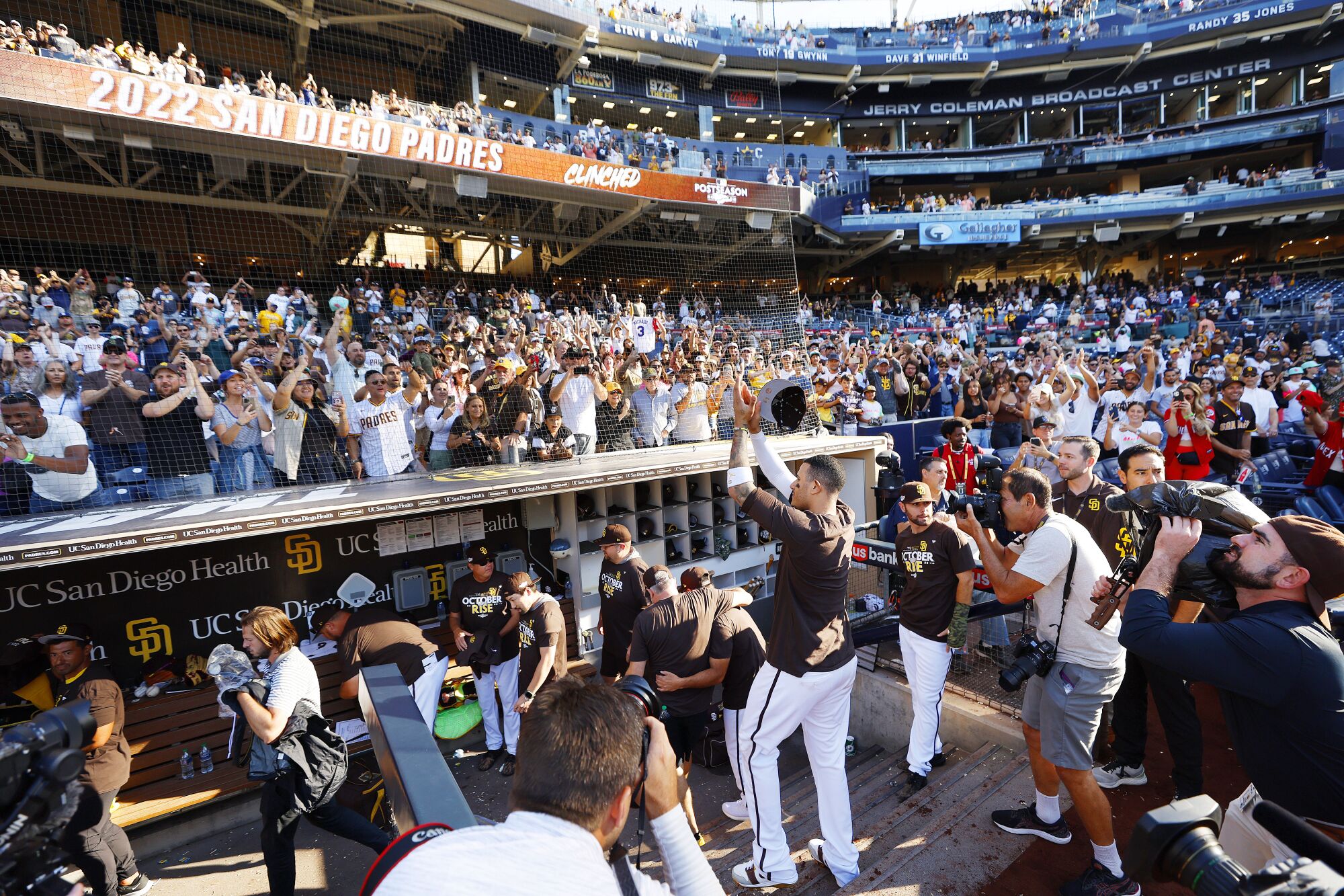 Padres' Manny Machado salutes the crowd after the team clinched a wildcard playoff spot.