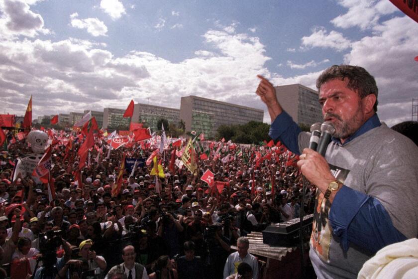 FILE - Honorary president of the Workers Party, Luiz Inacio Lula da Silva, speaks during a protest against the free-market reforms of President Fernando Henrique Cardoso, in Brasilia, Brazil, Aug. 26, 1999. (AP Photo/Beto Barata, File)