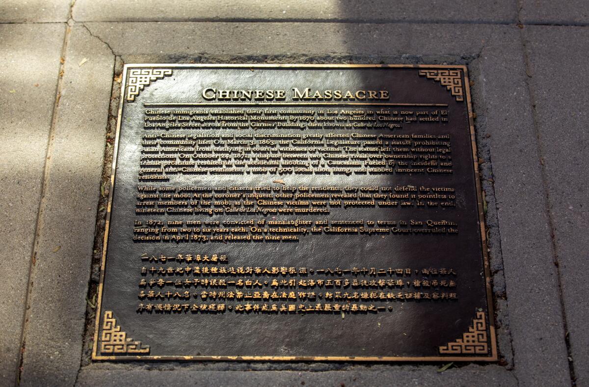 A sidewalk plaque on Los Angeles Street in downtown L.A. commemorates the Chinese massacre of 1871.