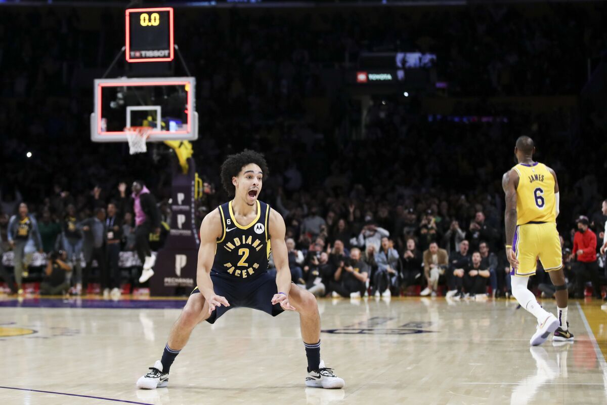 Indiana Pacers guard Andrew Nembhard celebrates after making the game-winning shot with seconds left against the Lakers.