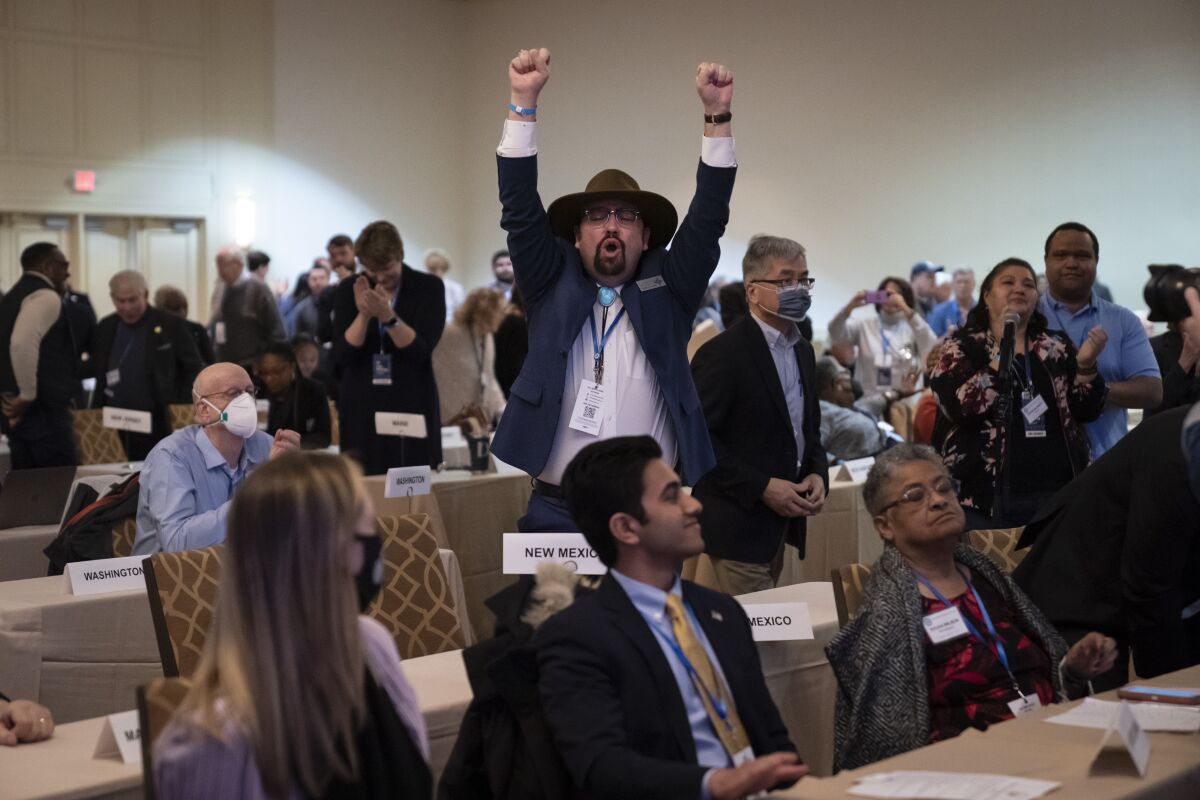 A committee member reacts after a vote