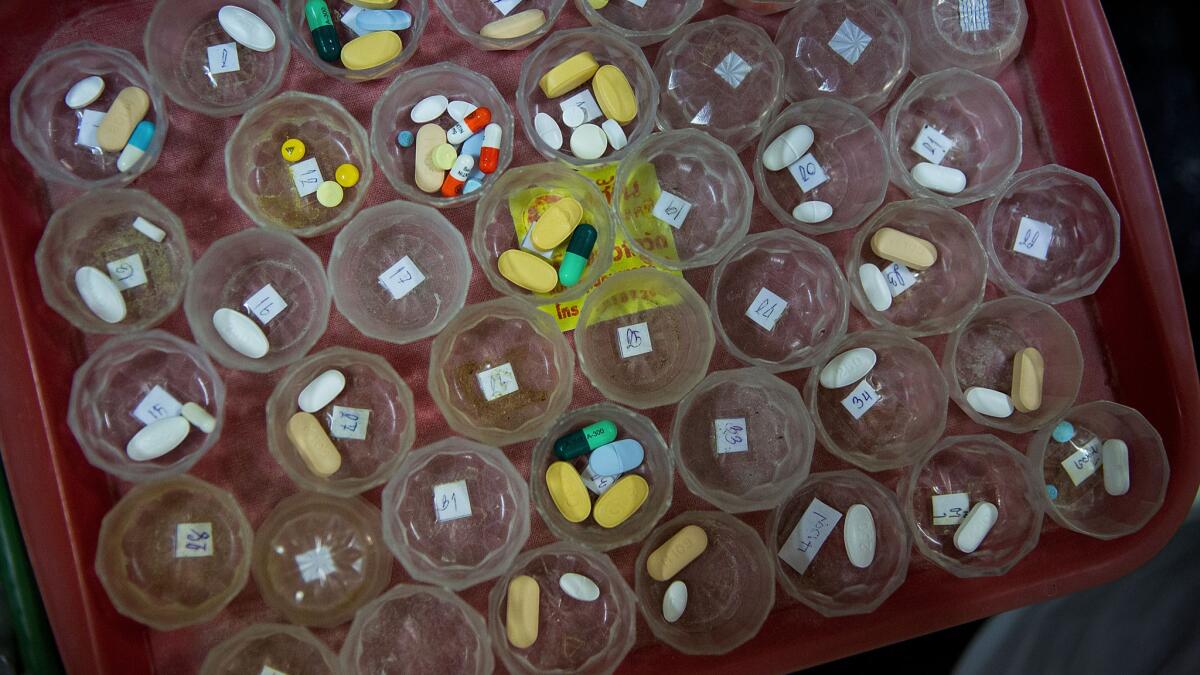 Pills are prepared for HIV/AIDS patients on February 21, 2015 at Wat Phra Bat Nam Phu in Lop Buri, Thailand.