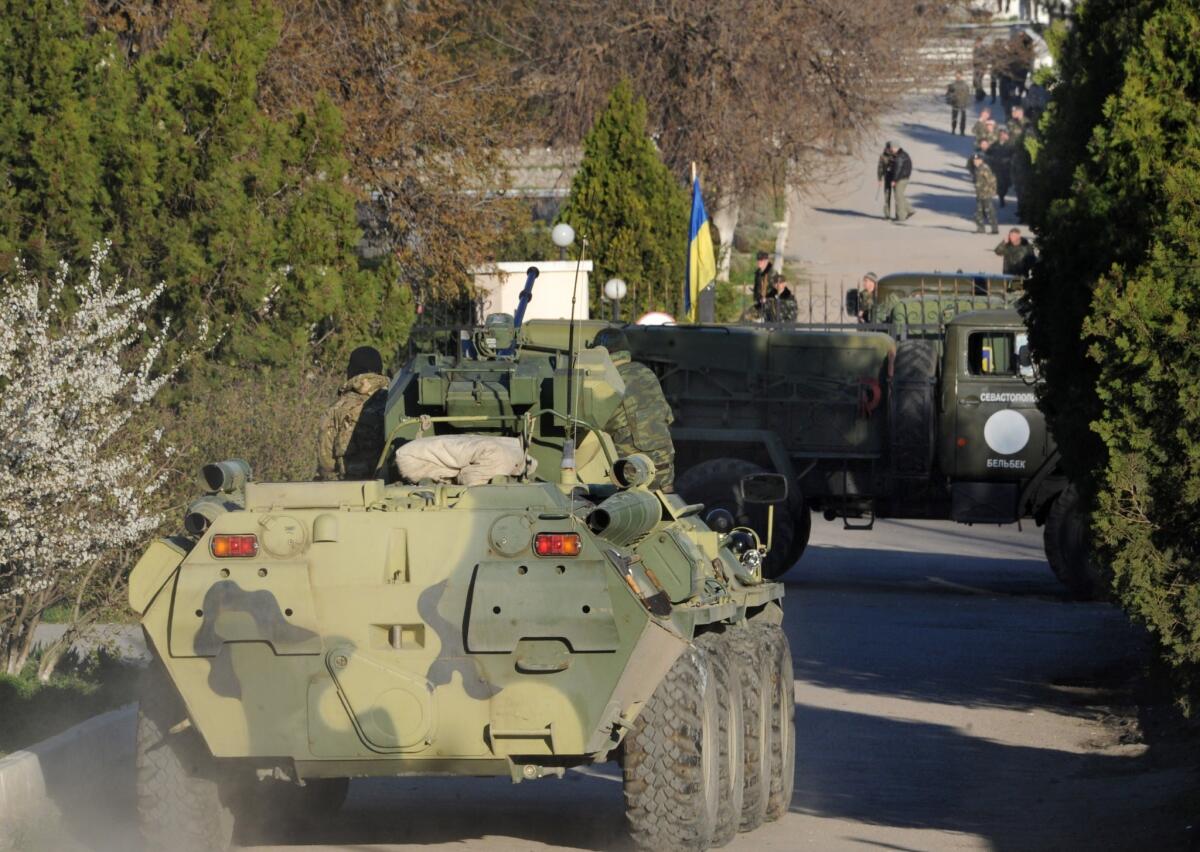 Russian tanks and soldiers storm a Ukrainian air force base in Belbek near the Crimean city of Sevastopol on Saturday.