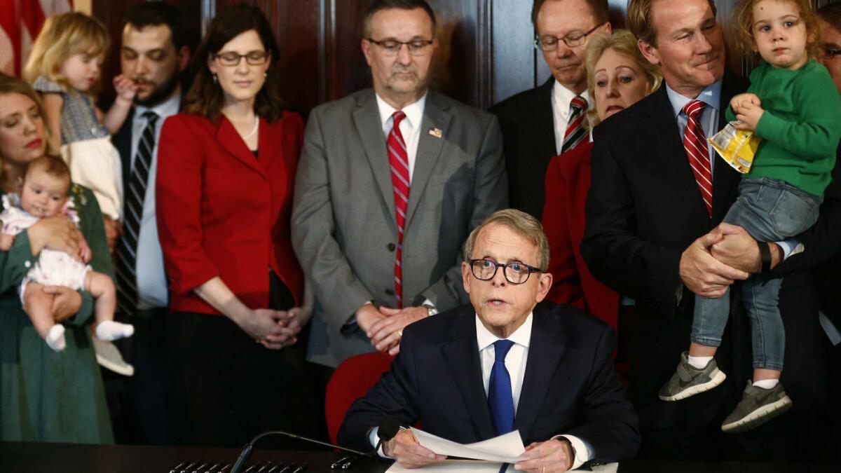 Ohio Gov. Mike DeWine before signing one of the nation's toughest abortion restrictions.