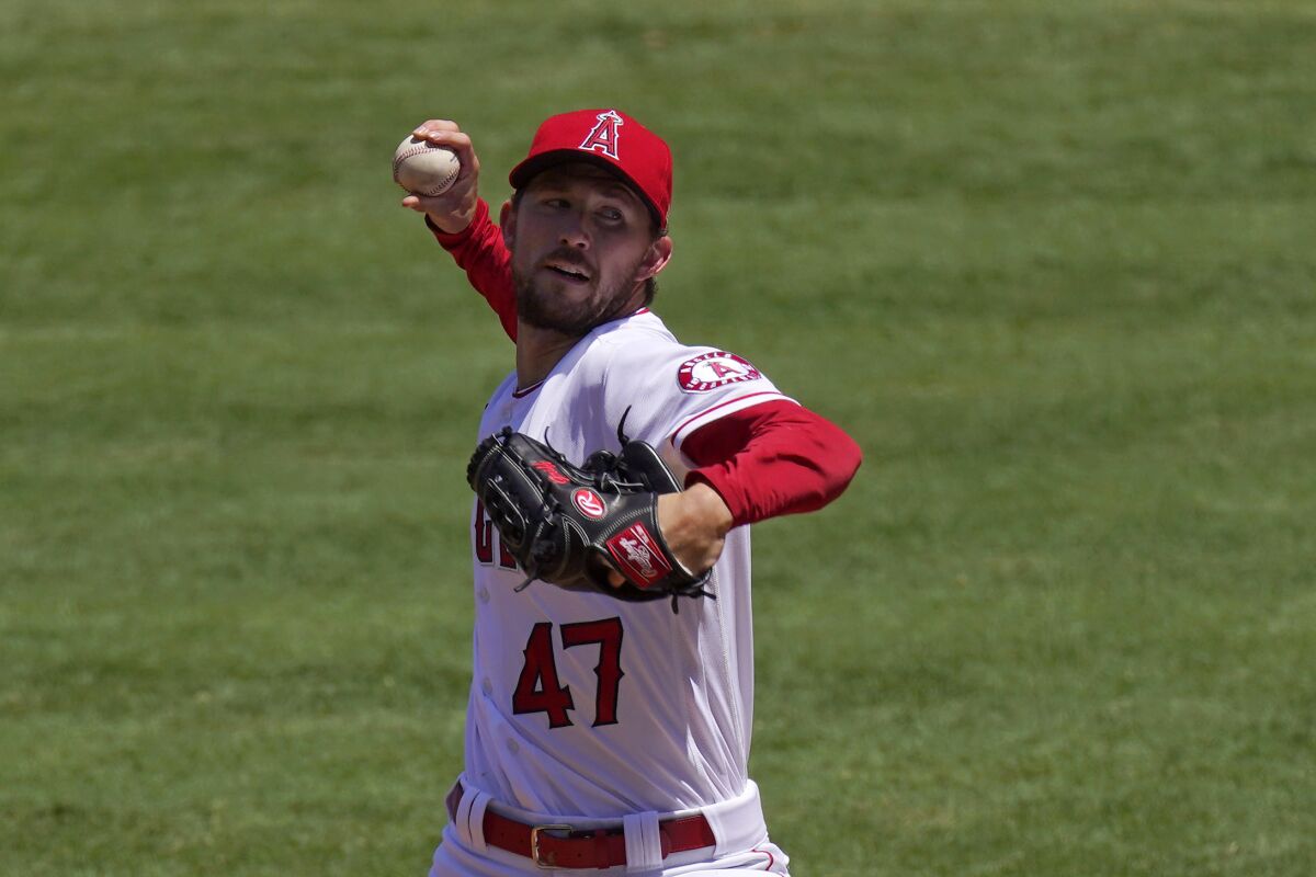 Angels pitcher Griffin Canning throws to the plate during the first inning against the Oakland Athletics.