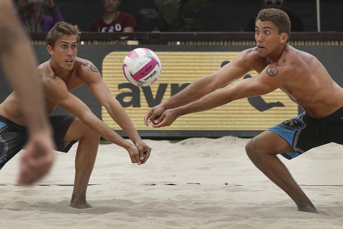 Brothers Taylor and Trevor Crabb race toward the ball during the 2016 AVP Huntington Beach Open championship.