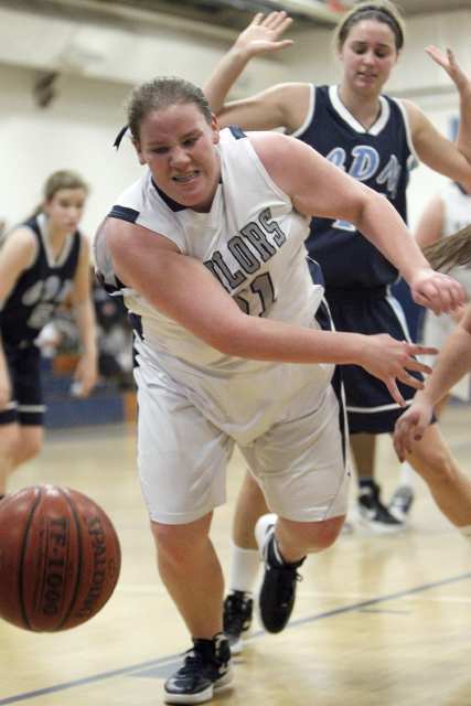 Newport Harbor High's Halle McClain, left, tries to chase down a loose ball during the first period against Corona del Mar.