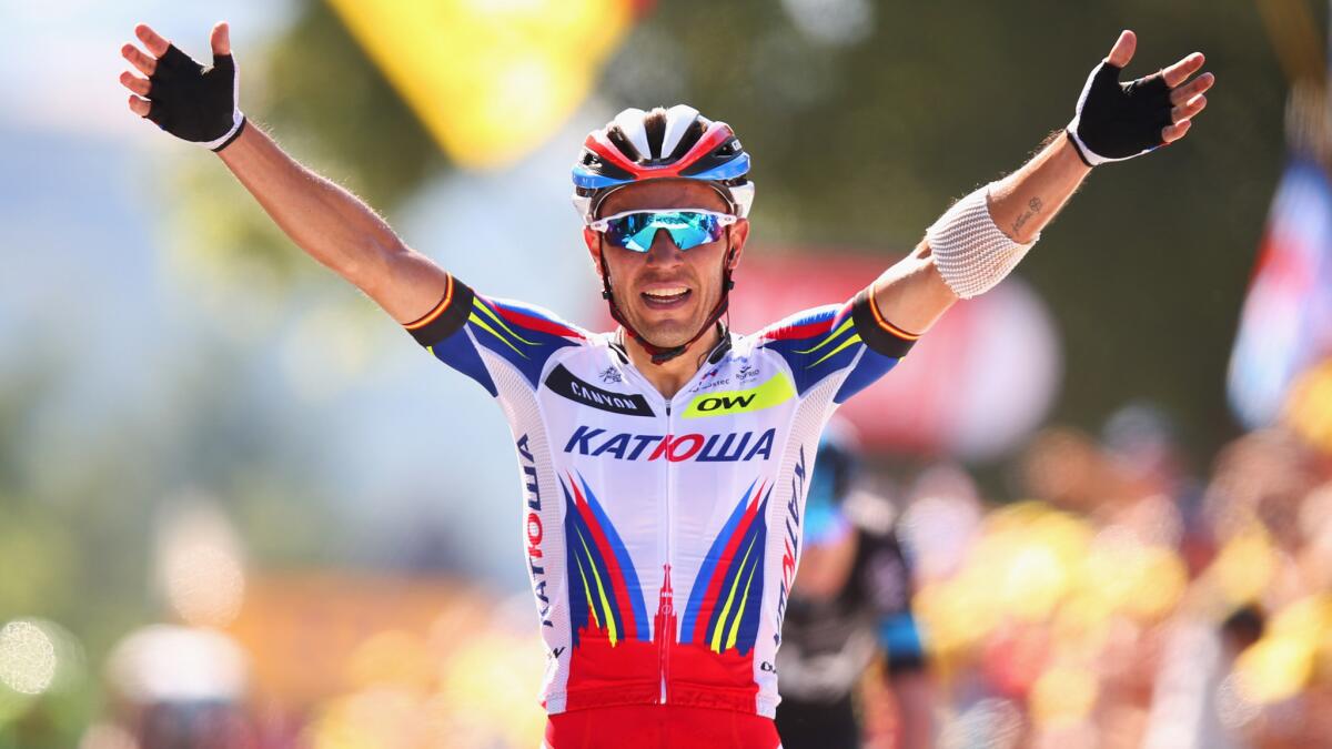 Joaquim Rodriguez celebrates after winning the third stage of the Tour de France in Huy, Belgium, on Monday.