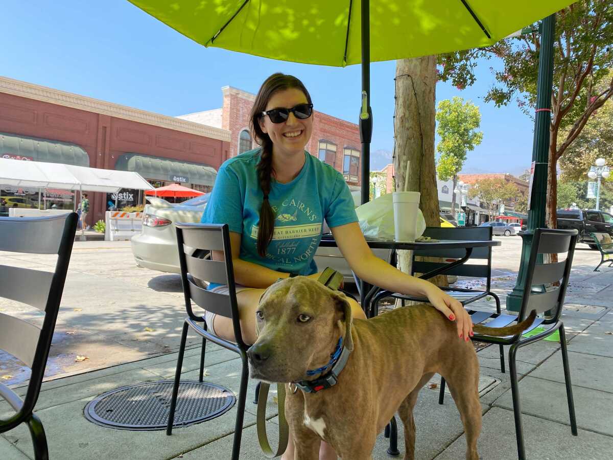 Stacey Storey, a 31-year-old Democrat, in Old Town Monrovia with her dog Agnes. 