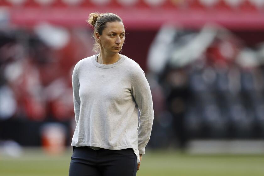 Gotham FC head coach Freya Coombe looks on during warmups before an NWSL soccer match against the Houston Dash, Saturday, May 15, 2021, in Harrison, N.J. (AP Photo/Steve Luciano)