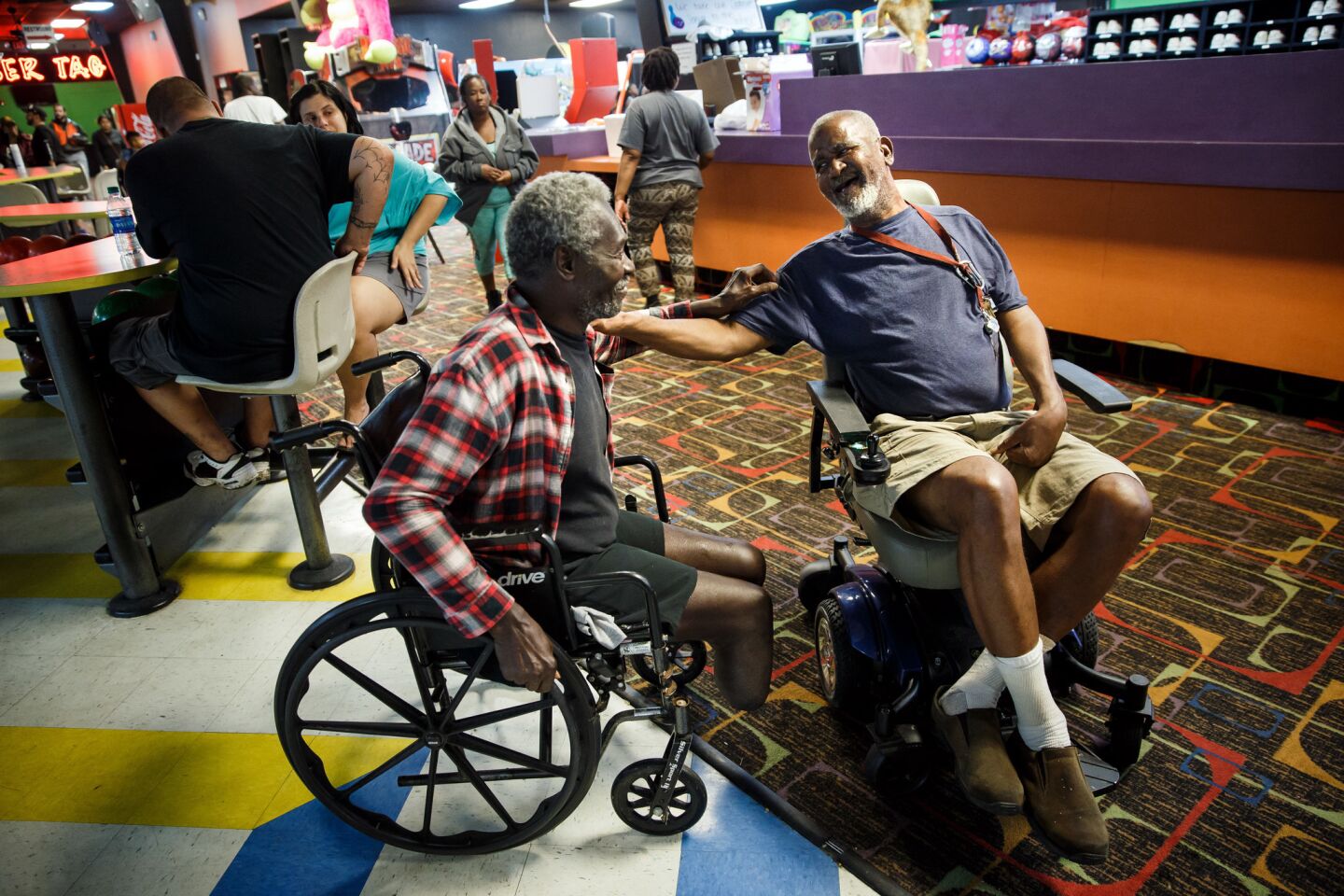James Benoit, left, and George Clipton sought refuge at Max Bowl in Port Arthur, Texas.