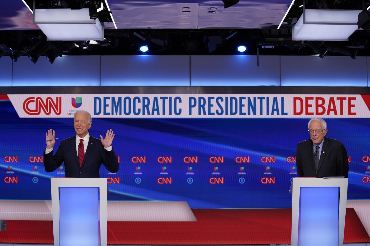 Former Vice President Joe Biden and Sen. Bernie Sanders, participate in a Democratic presidential primary debate at CNN Studios in Washington on Sunday.