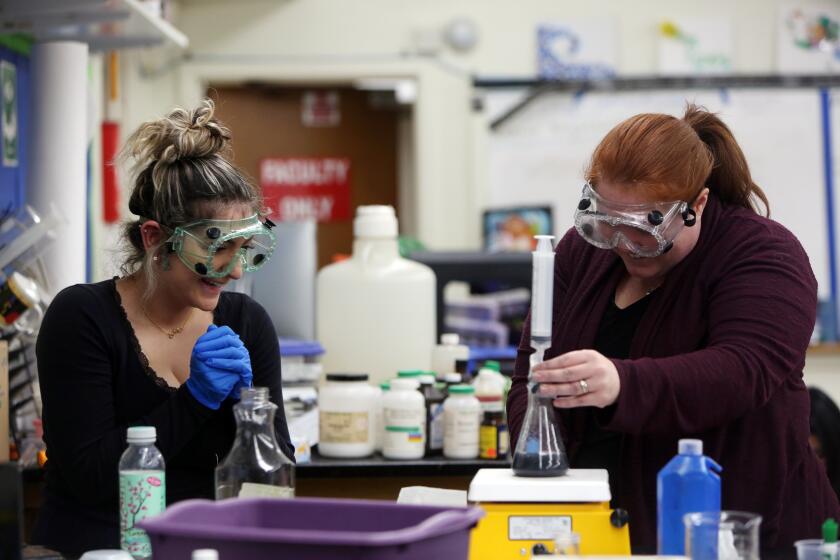 LOS ANGELES, CA-DECEMBER 13, 2019: Tiffany Dorgalli, 17, left, works with teacher Jeanette Chipps, right, on a project at Granada Hills Charter High School, on December 13, 2019 in Los Angeles, California. Chipps' class incorporates climate change into her curriculum and projects. (Photo By Dania Maxwell / Los Angeles Times)
