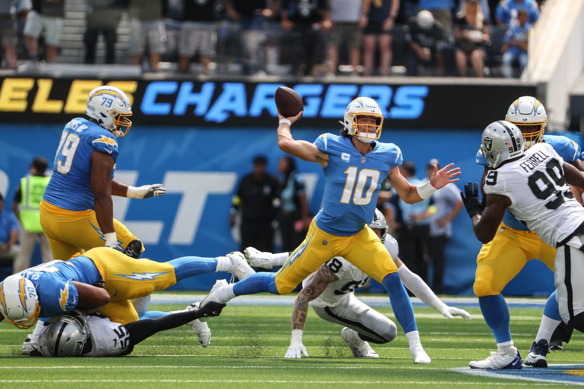Chargers quarterback Justin Herbert passes against the Las Vegas Raiders.