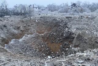 FILE - In this photo provided by the Ukrainian Emergency Service, a crater of an explosion is seen next to the private building destroyed after a Russian missile attack in Novomoskovsk, near Kryvyi Rih, Ukraine, Monday, Jan. 8, 2024. Russia’s recent escalation of missile and drone attacks is stretching Ukraine’s air defense resources, a Ukrainian air force official said Tuesday, Jan. 9, 2024, leaving the country vulnerable in the 22-month war unless it can secure further weapons supplies. (Ukrainian Emergency Service via AP, File)