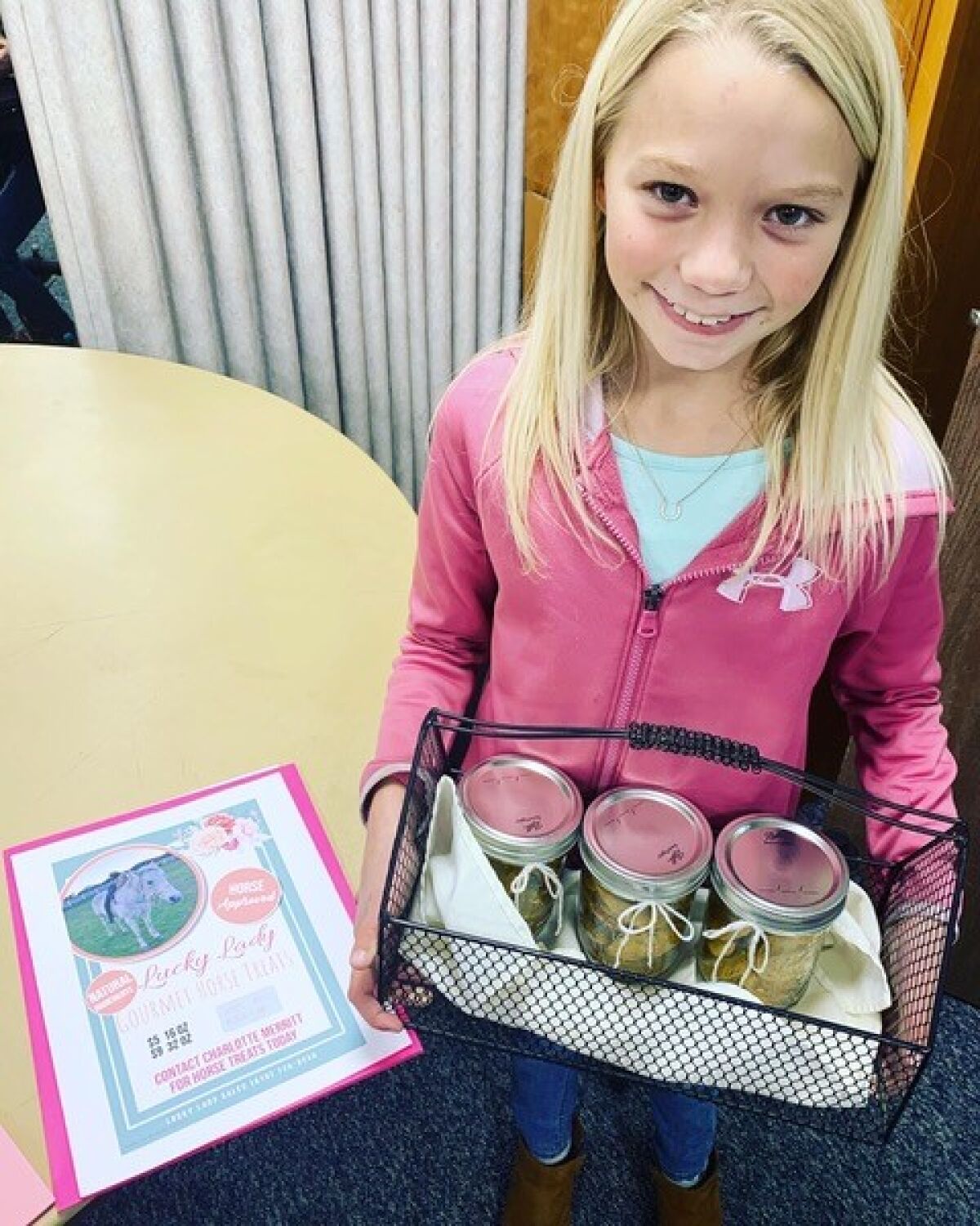 Charlie Merritt, 9, proudly displays some of her homemade horse treats.