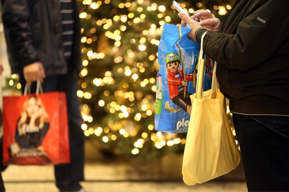 Customers shop at a mall on Dec. 1 in Berlin, Germany.