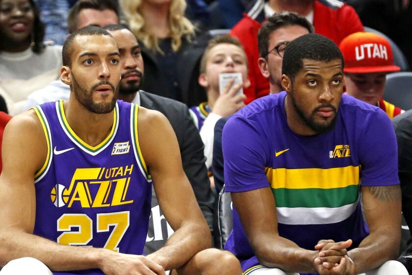 From left to right, Utah Jazz's Raul Neto (25), Rudy Gobert (27) and Derrick Favors look on as they sit on the bench late in to the second half during an NBA basketball game against the Indiana Pacers Monday Nov. 26, 2018, in Salt Lake City. (AP Photo/Rick Bowmer)