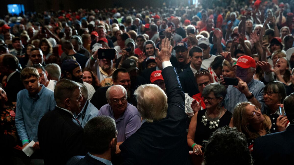 Republican presidential candidate Donald Trump waves as he leaves a campaign rally on Aug. 12 in Altoona, Pa.