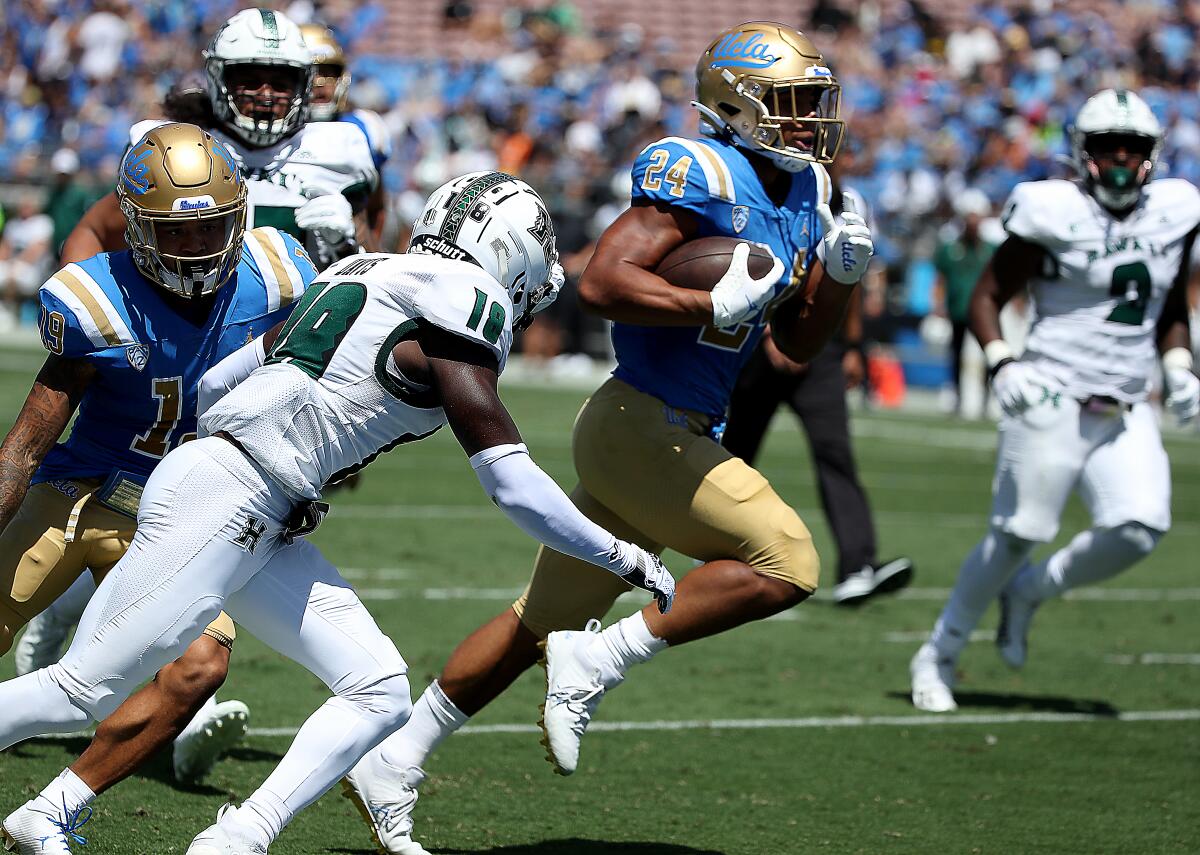UCLA running back Zach Charbonnet breaks free for a touchdown against Hawaii in a game at the Rose Bowl on Aug. 28.