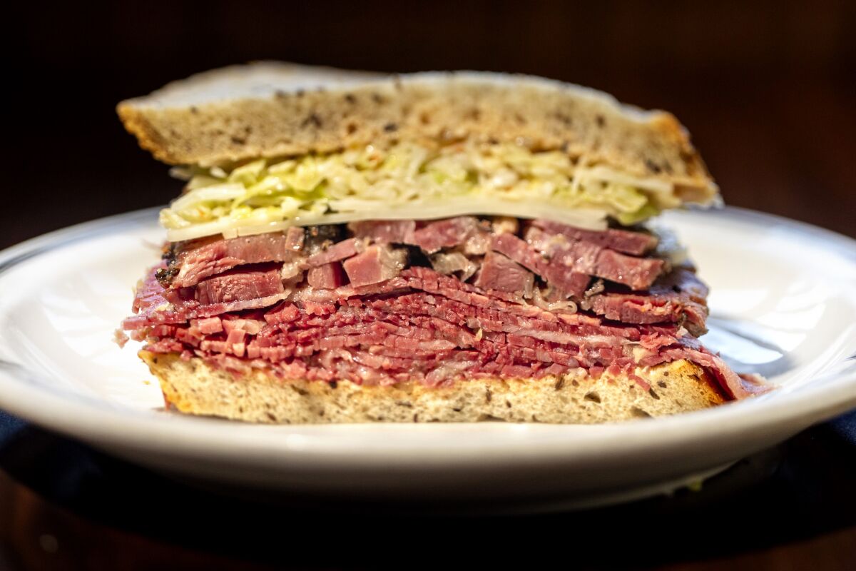 The #54, a pastrami and corned beef combo sandwich, dressed in the style of the #19, with Swiss cheese and cole slaw and Russian style dressing, from Langer's Deli.