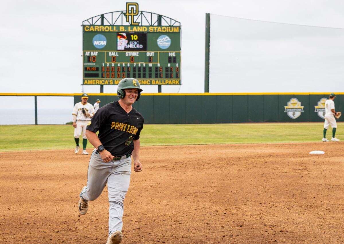 Point Loma Nazarene's Eric Smelko circles the bases on his three-run homer in the sixth inning.