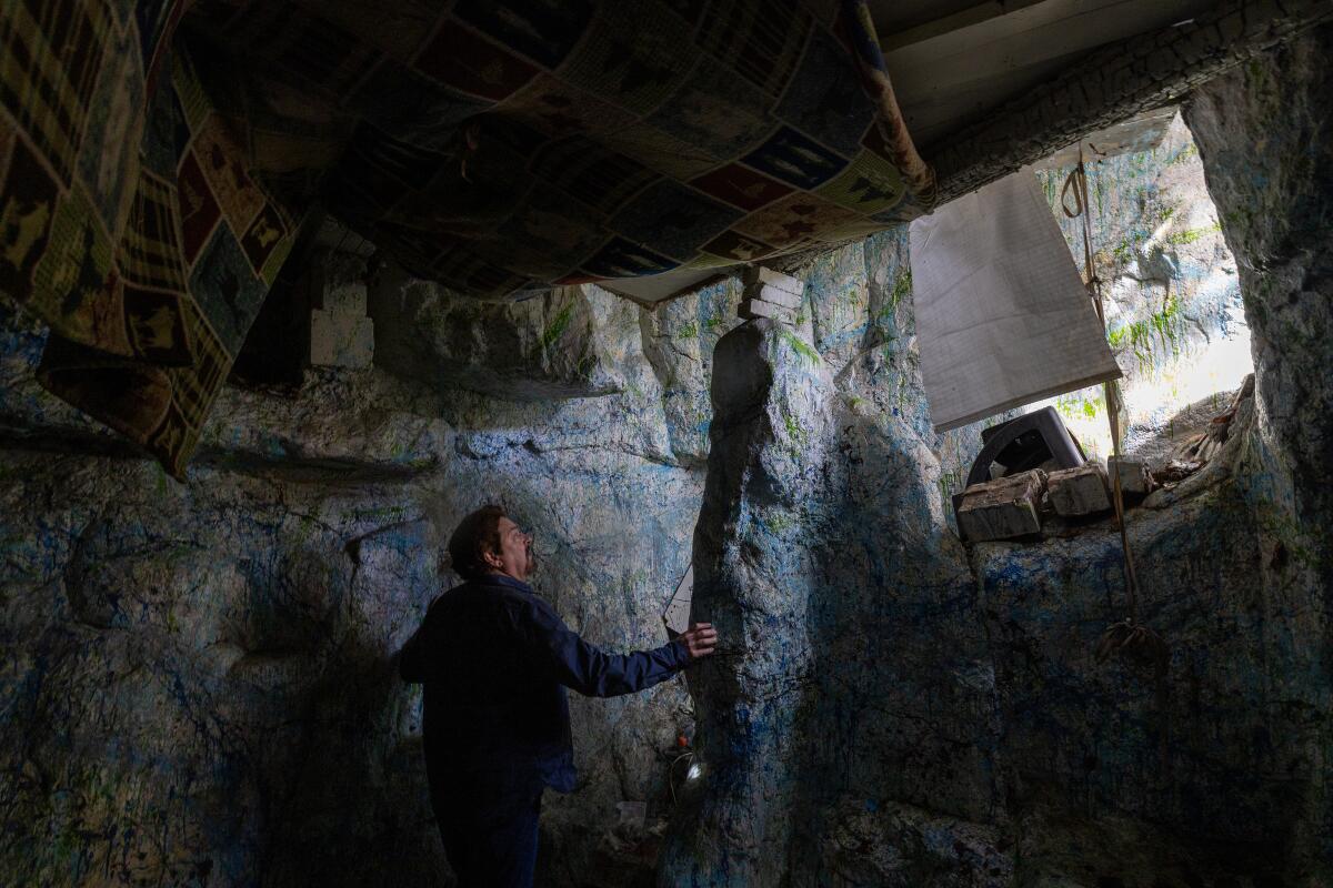 Tony Tucci stands in a cast concrete cave on a Laurel Canyon property which conservationists hope to purchase