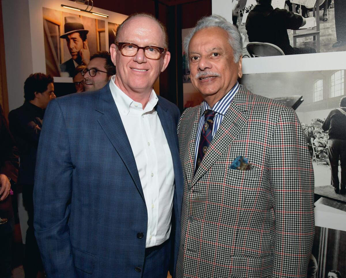 Capitol Music Group Chairman and CEO Steve Barnett, left, and I.M.I. Incorporated Chairman and CEO Bhaskar Menon