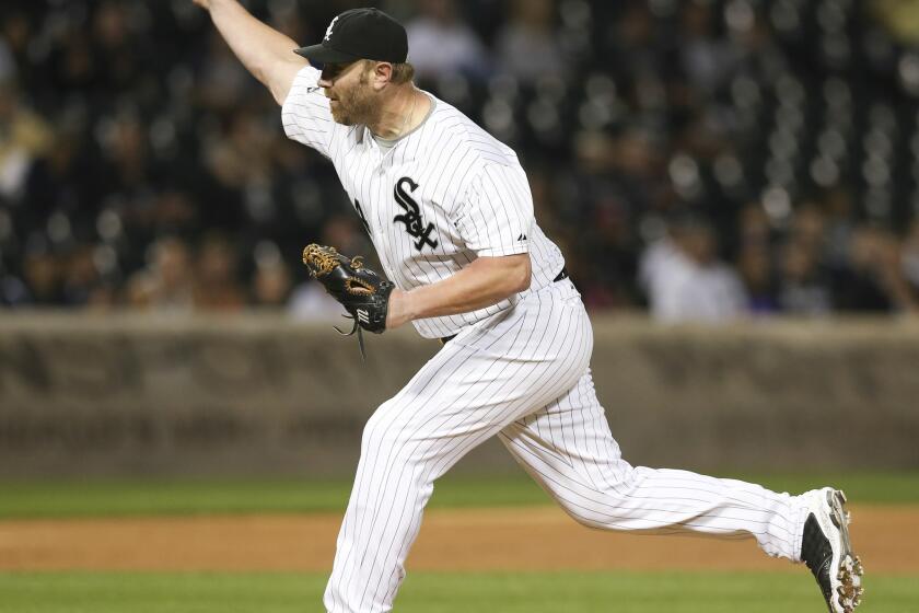 White Sox designated hitter Adam Dunn pitching in the ninth inning of the White Sox's 16-0 loss to the Rangers on Thursday at U.S. Celluar Field.