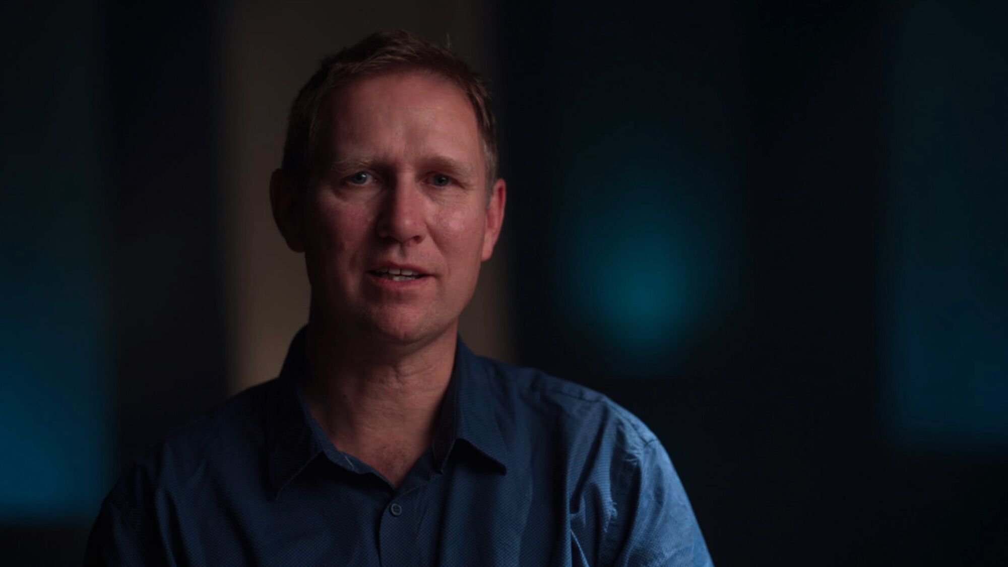 A doctor talks to the camera while participating in a documentary